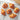 A set of freshly baked croissants and pain au chocolats on a cooling rack.